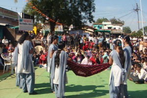 Students performing a roadside drama on Save girl Child and education awareness